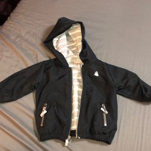 Soft striped inner lining for coat. Two outer zip pockets.